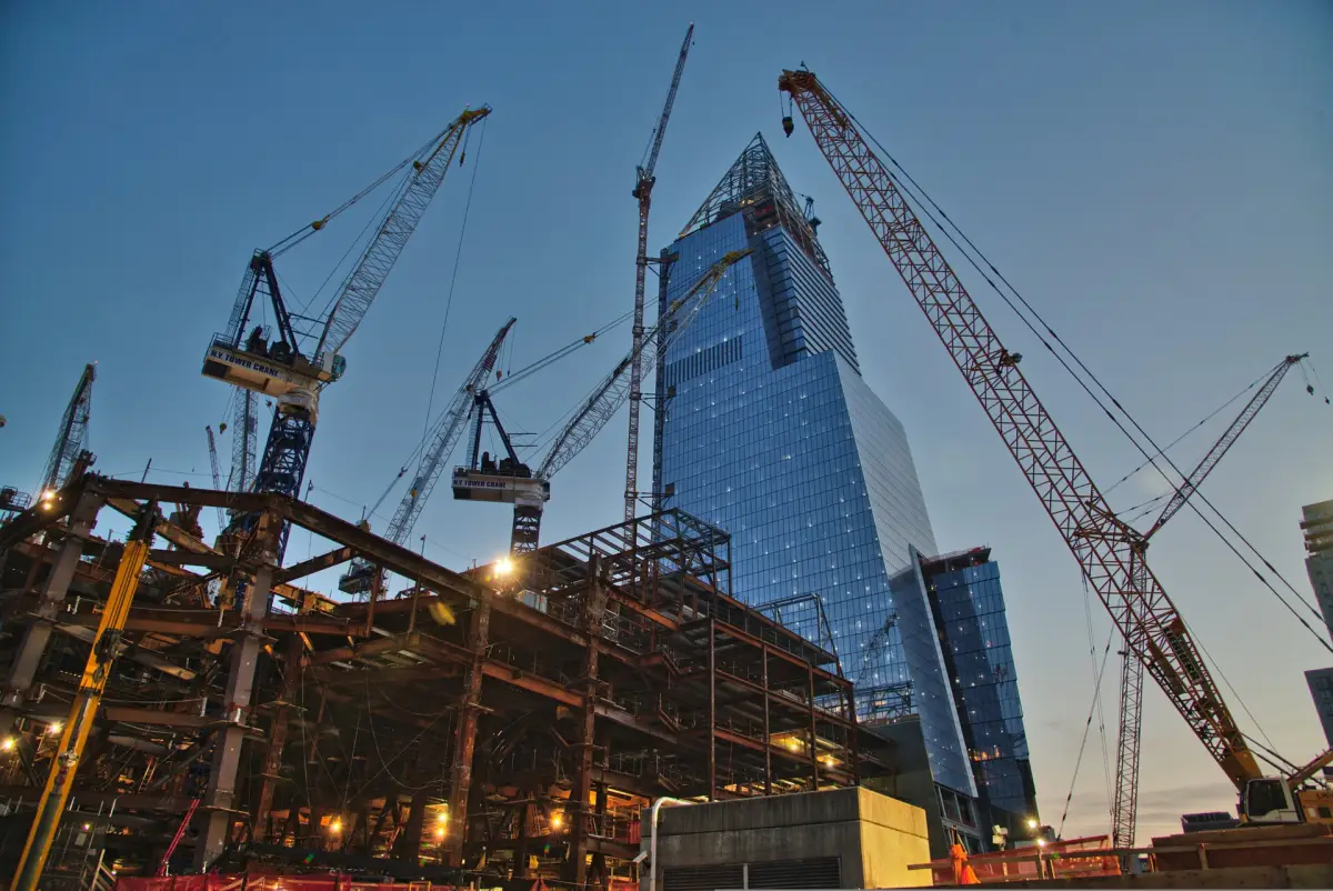 Construction site with cranes at dusk